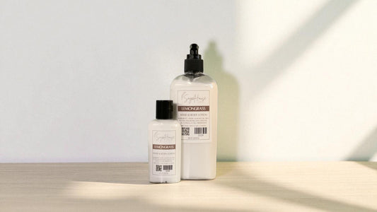 Two white bottles of lotion with black cap and black pump top on a light wooden surface with a blurred white background