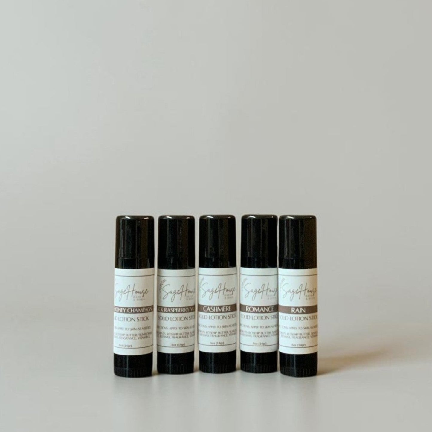 Five black tubes with labels on a light gray background