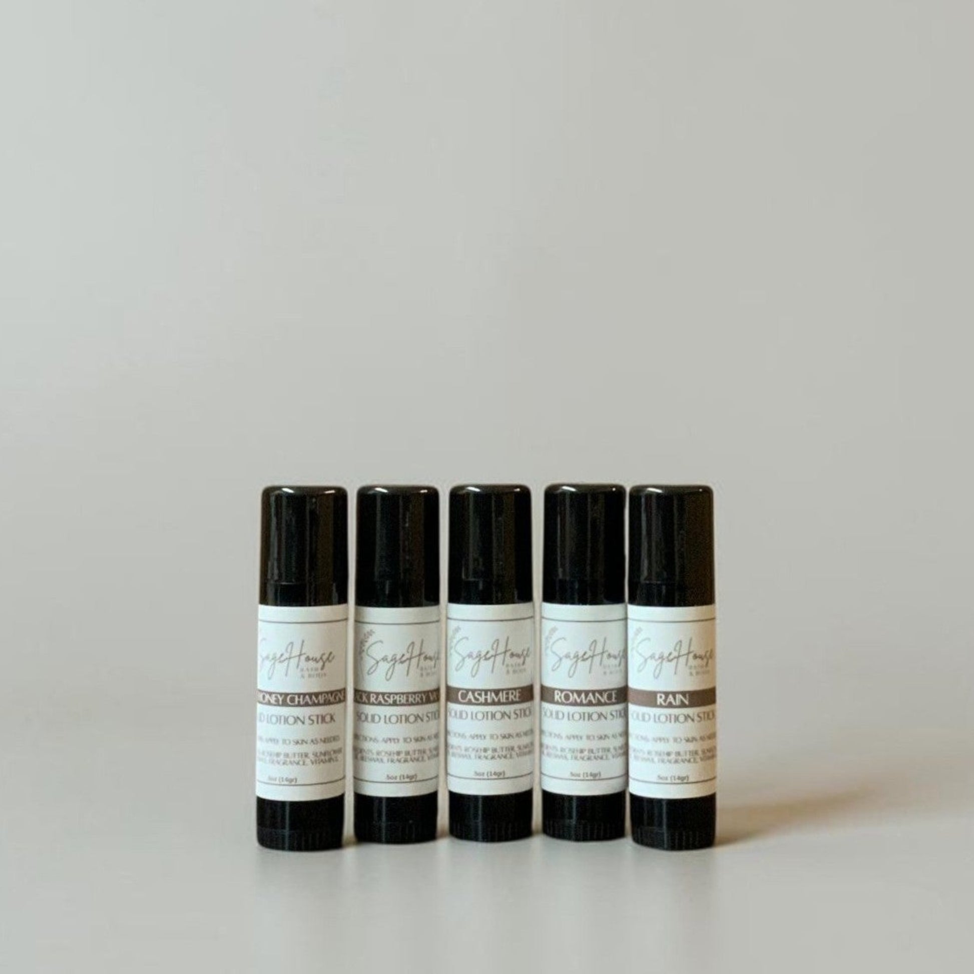 Five black tubes with labels on a light gray background
