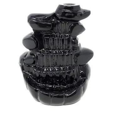 A black metal waterfall style cone incense burner