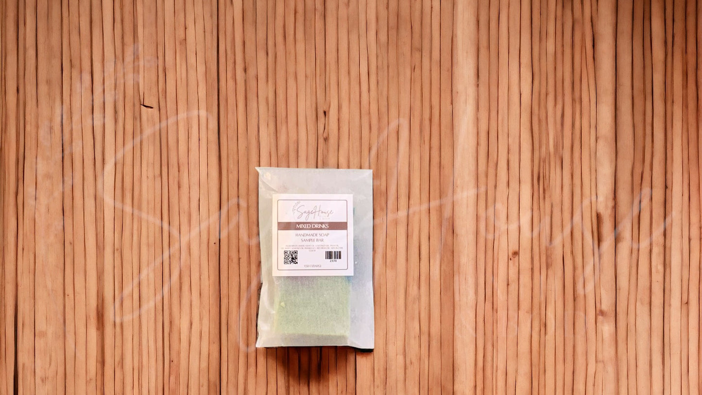 A sample bar of soap in a glassine bag. placed on a wood surface.