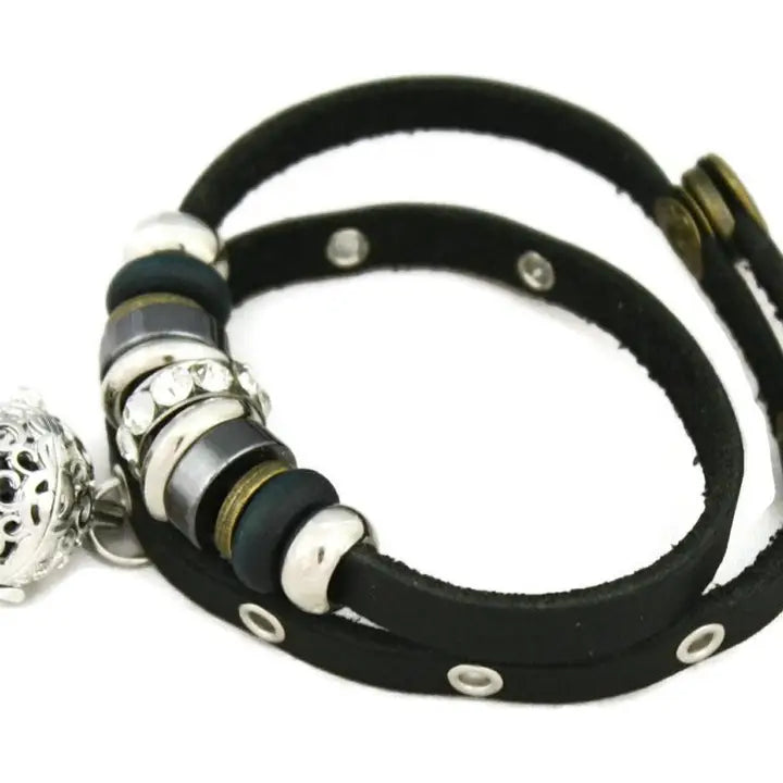 bracelet with black leather and silver, black & gemstone beaded accents. lava bead inside of silver ball