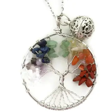A silver multi colored chackra tree necklace with lava bead inside. on a silver chain