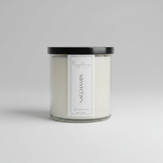 A white soy wax candle in a clear container, on a neutral background