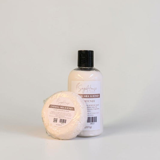 A bottle of conditioner and shampoo bar on a white background.