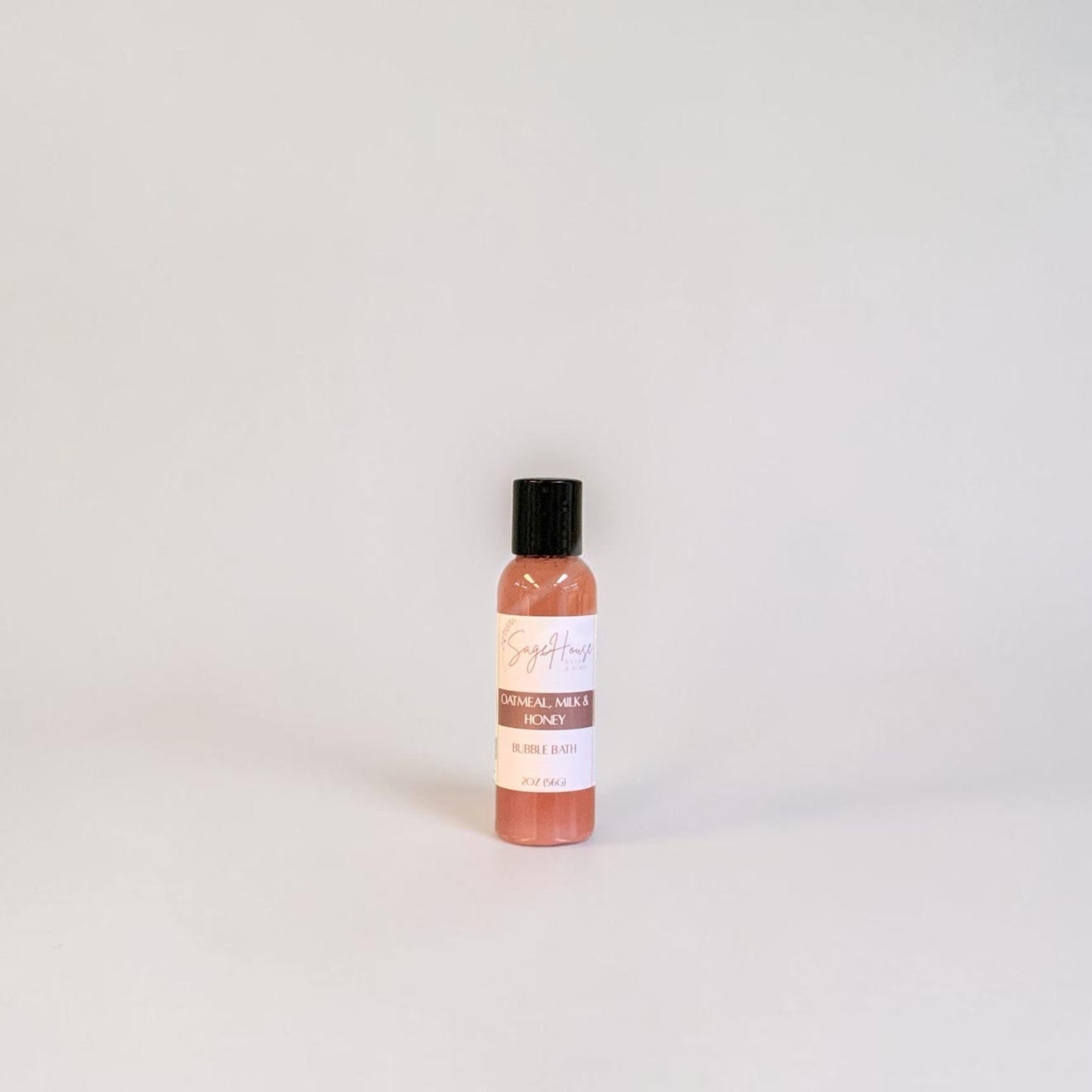 Bottle of bubble bath on a light gray background