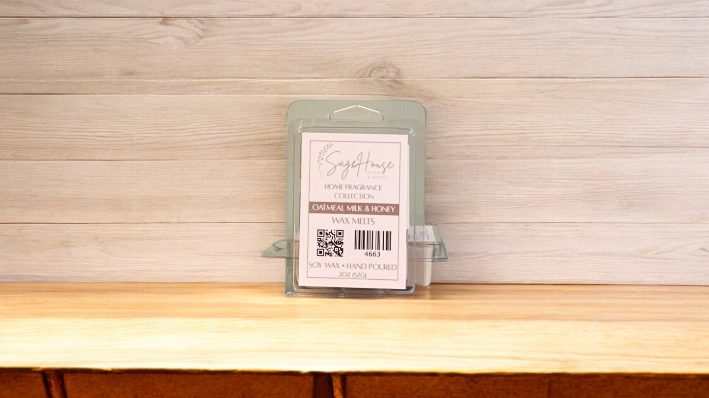 A clear clamshell container holding 6 wax melt cubes with a label on top, placed on a wooden surface against a wooden background.