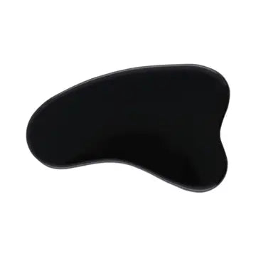 An Obsidian Gua Sha on a white background