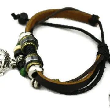 bracelet with brown leather and silver, black & green beaded accents. lava bead inside of silver ball