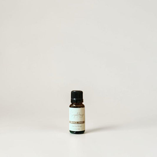 Amber bottle with label on a grey background.