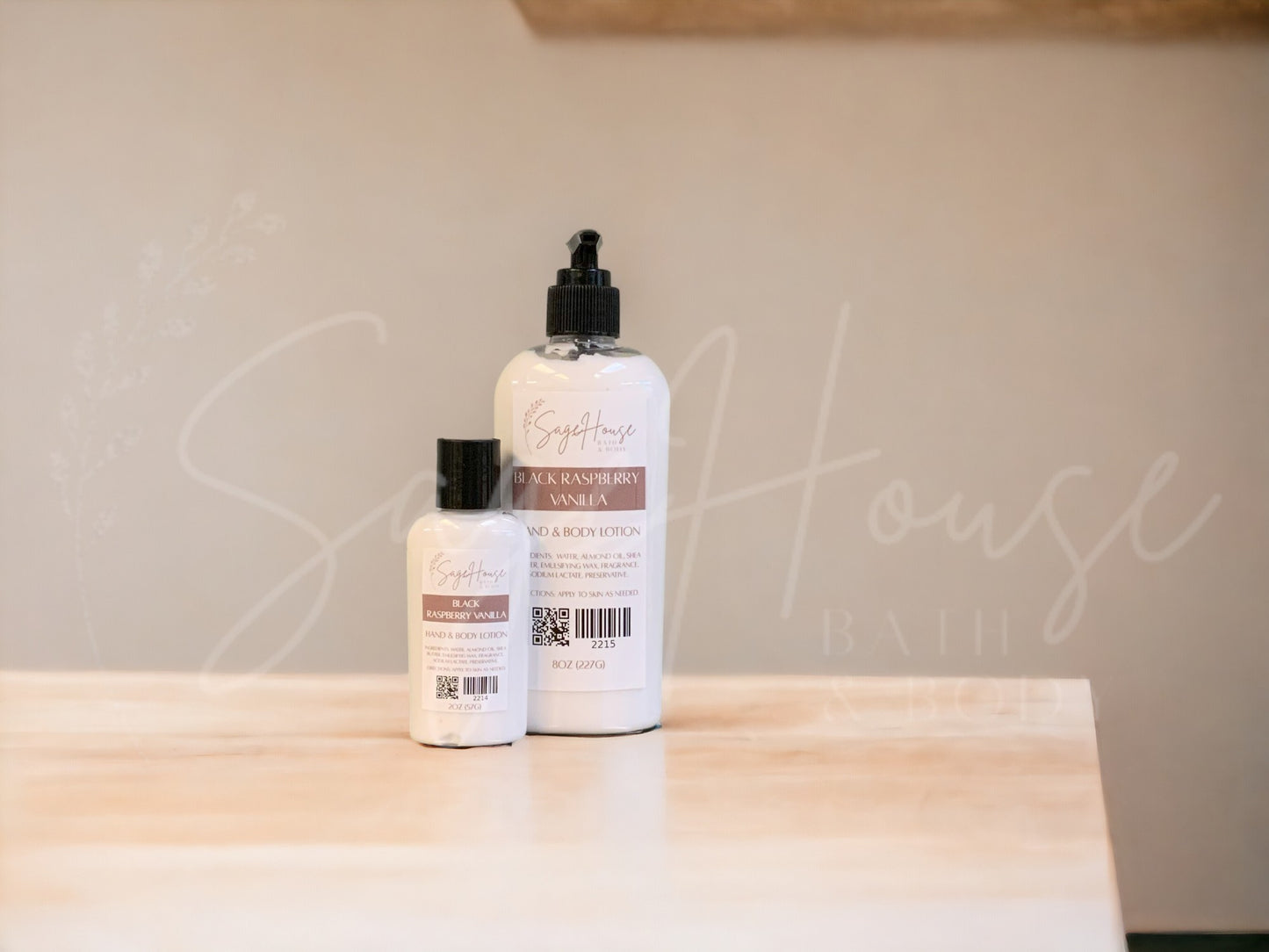 Two bottles of lotion with black caps on a wooden surface with a neutral background
