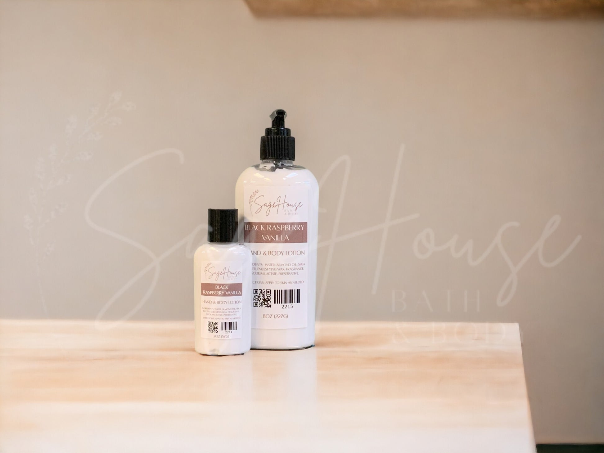 Two bottles of lotion with black caps on a wooden surface with a neutral background