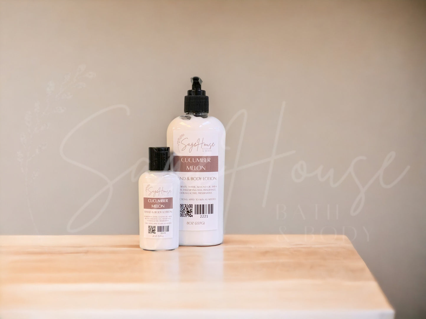 Two bottles of lotion with black caps on a wooden surface with a neutral background