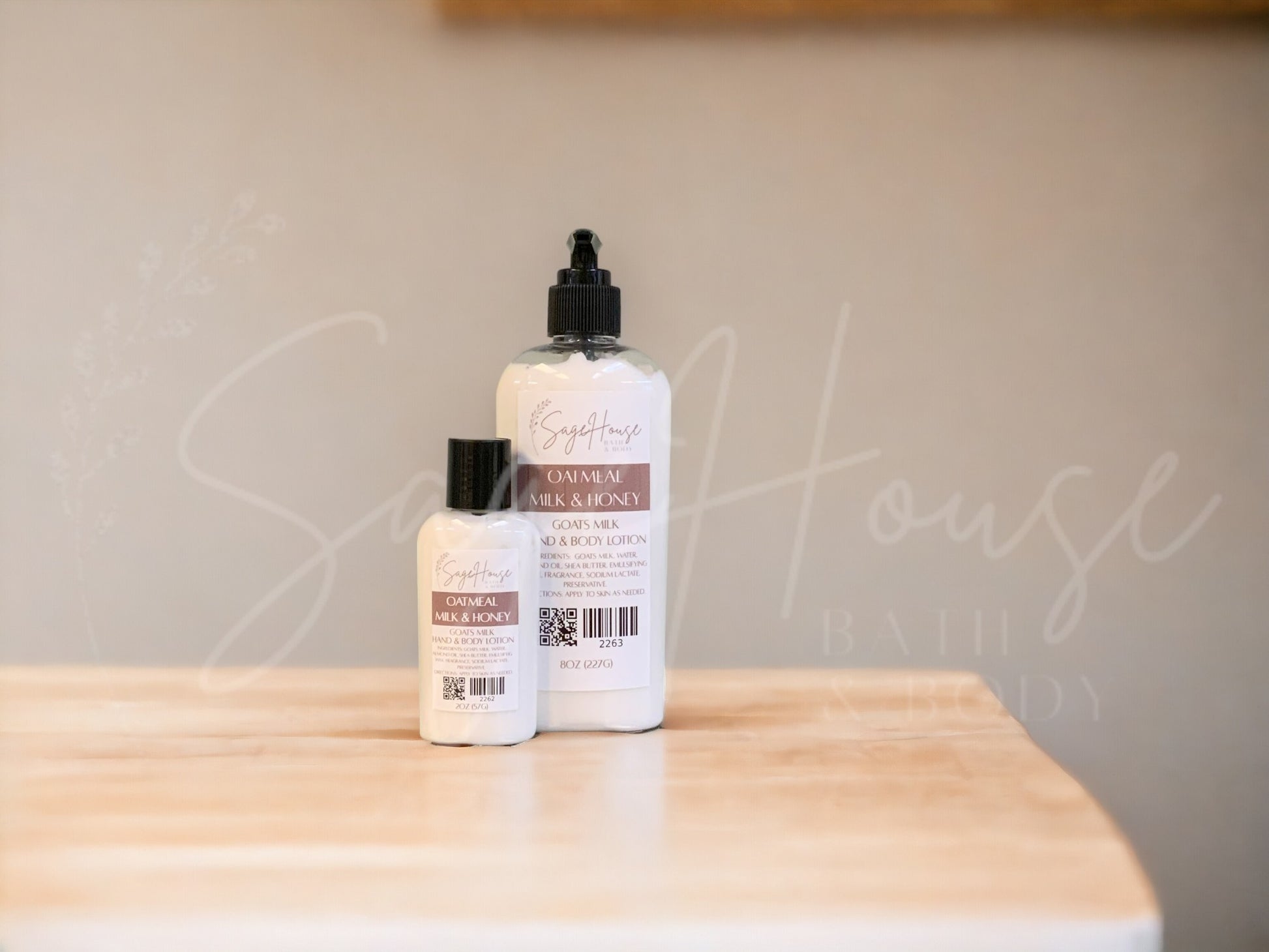 Two bottles of lotion with black caps on a wooden surface with a neutral background