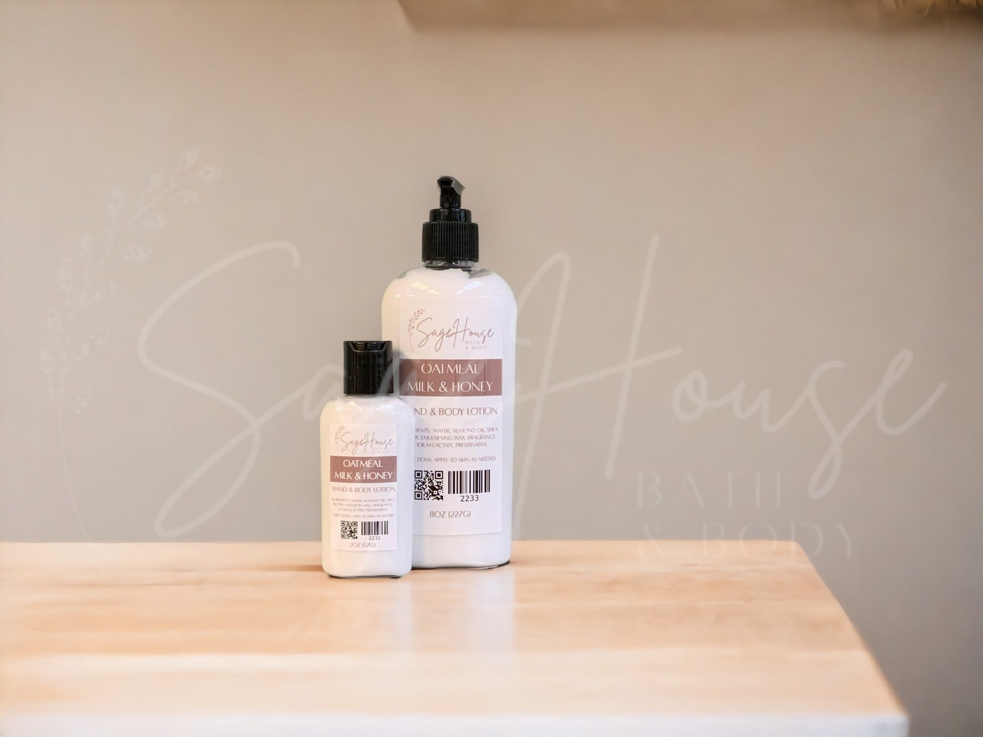 Two bottles of lotion with black caps on a wooden surface with a neutral background