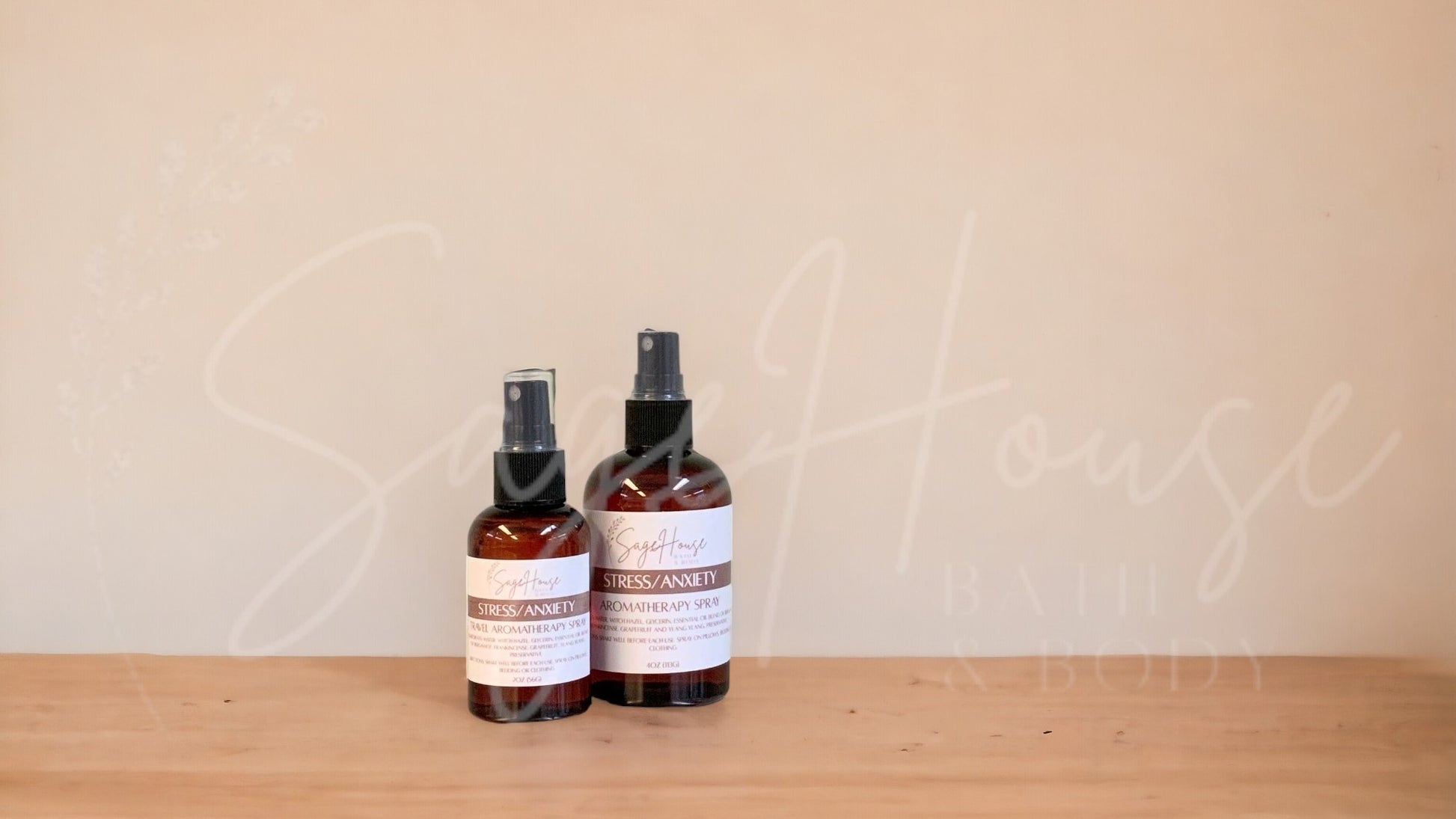 2 Amber colored spritz bottles with anxiety and stress labels, on wood surface