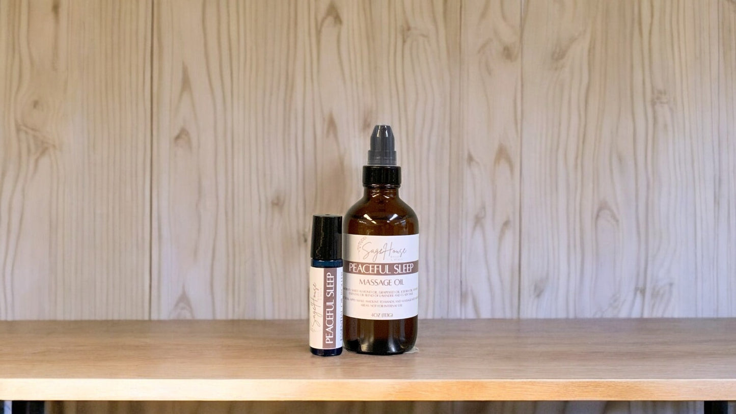 A bottle with a treatment pump, and a roller bottle labeled with 'Peaceful sleep Massage Oil', positioned on a wooden surface.