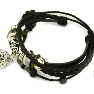 bracelet with black leather and silver and black beaded accents. lava bead inside of silver ball