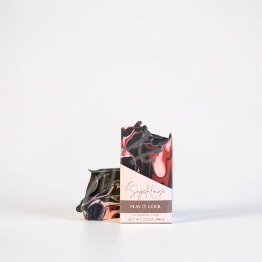 A labeled bar of soap sitting in front of a matching bar. On a white background.