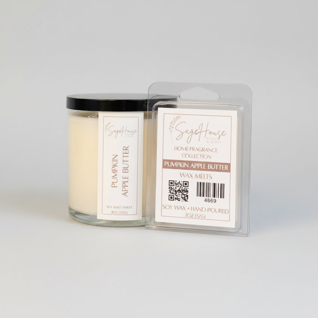 A white soy wax candle in a clear container, next to a clear clamshell wax melt package. placed on a wooden surface, with a label on the front.