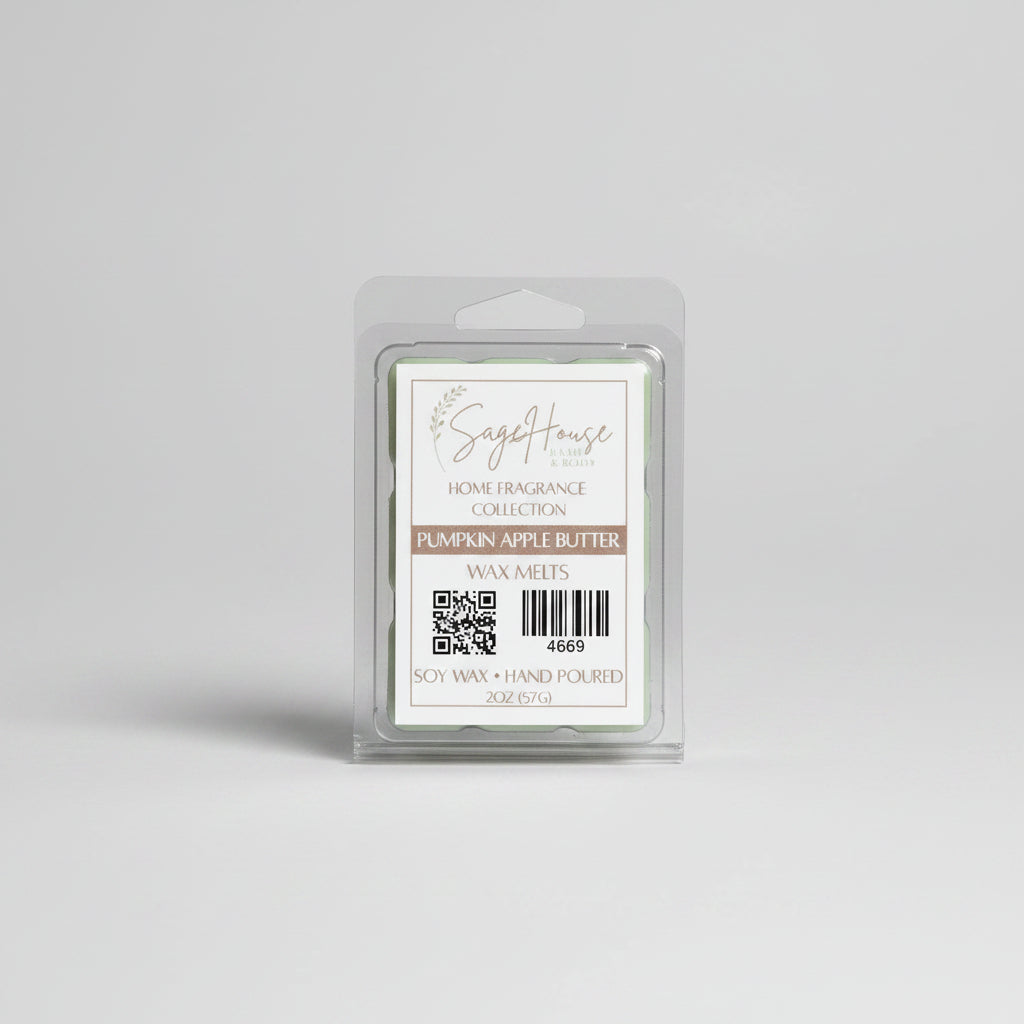 A clear clamshell container holding 6 wax melt cubes with a label on top, placed on a wooden surface against a wooden background.