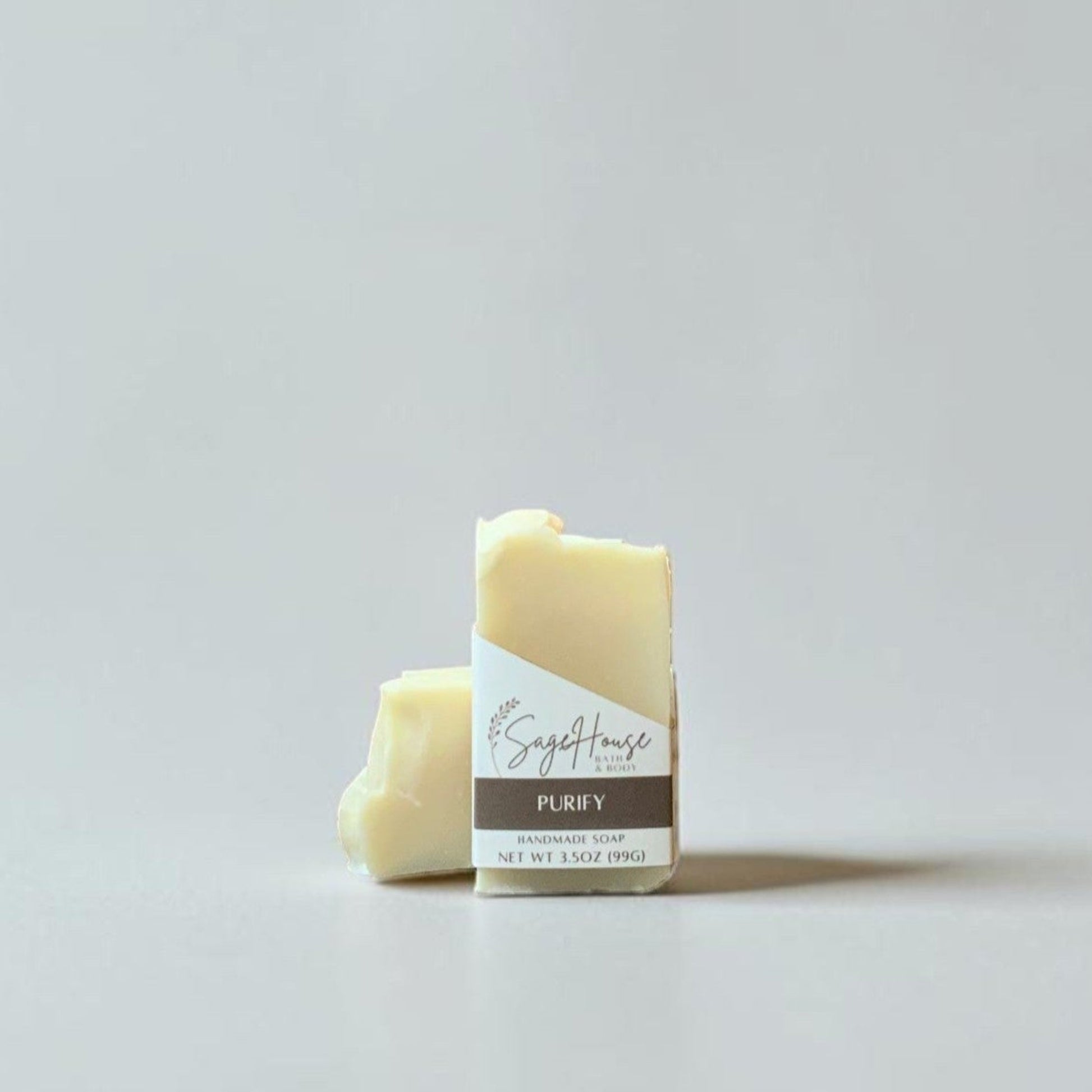 2 bars of soap on a grey background.