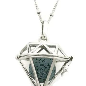 A silver diamond shaped necklace with lava bead inside. on a silver chain