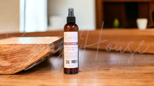 An amber colored bottle with spritz top. On wooden surface with modern background