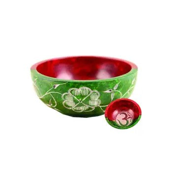 A Soapstone Bowl with Red and Green colors, with flower and Zen designs on a white background