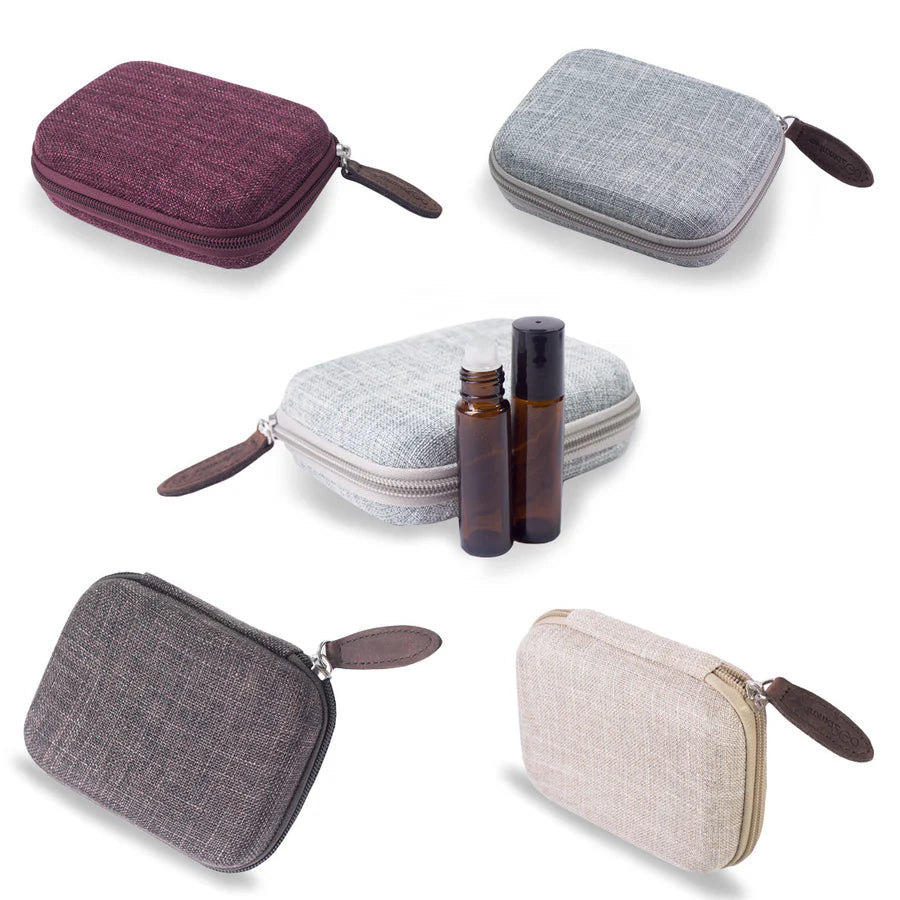 A collection of four essential oil roller bottle cases in different colors: burgundy, ocean, hemp, sand, and a neutral beige color.