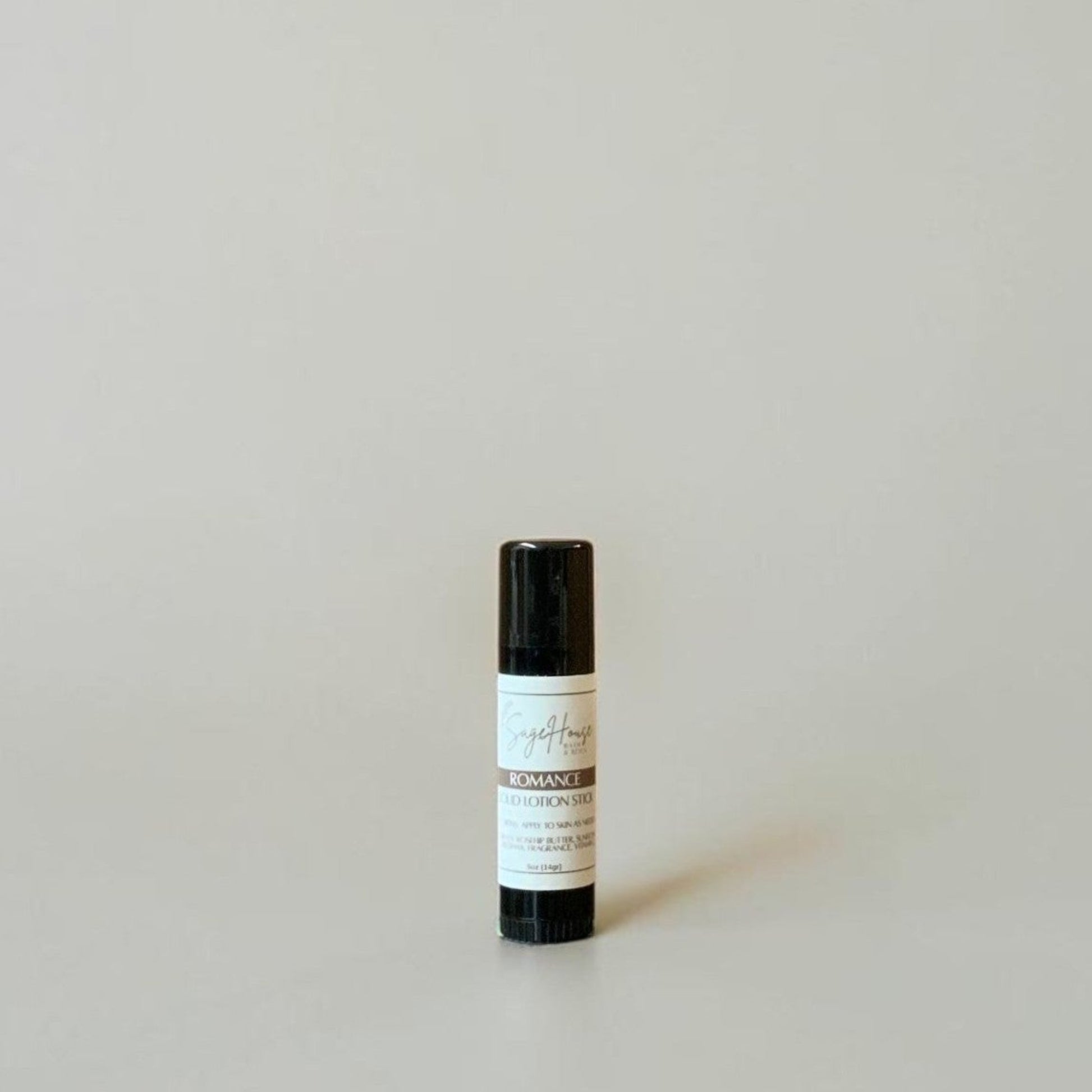 A black tube with label on a light gray background