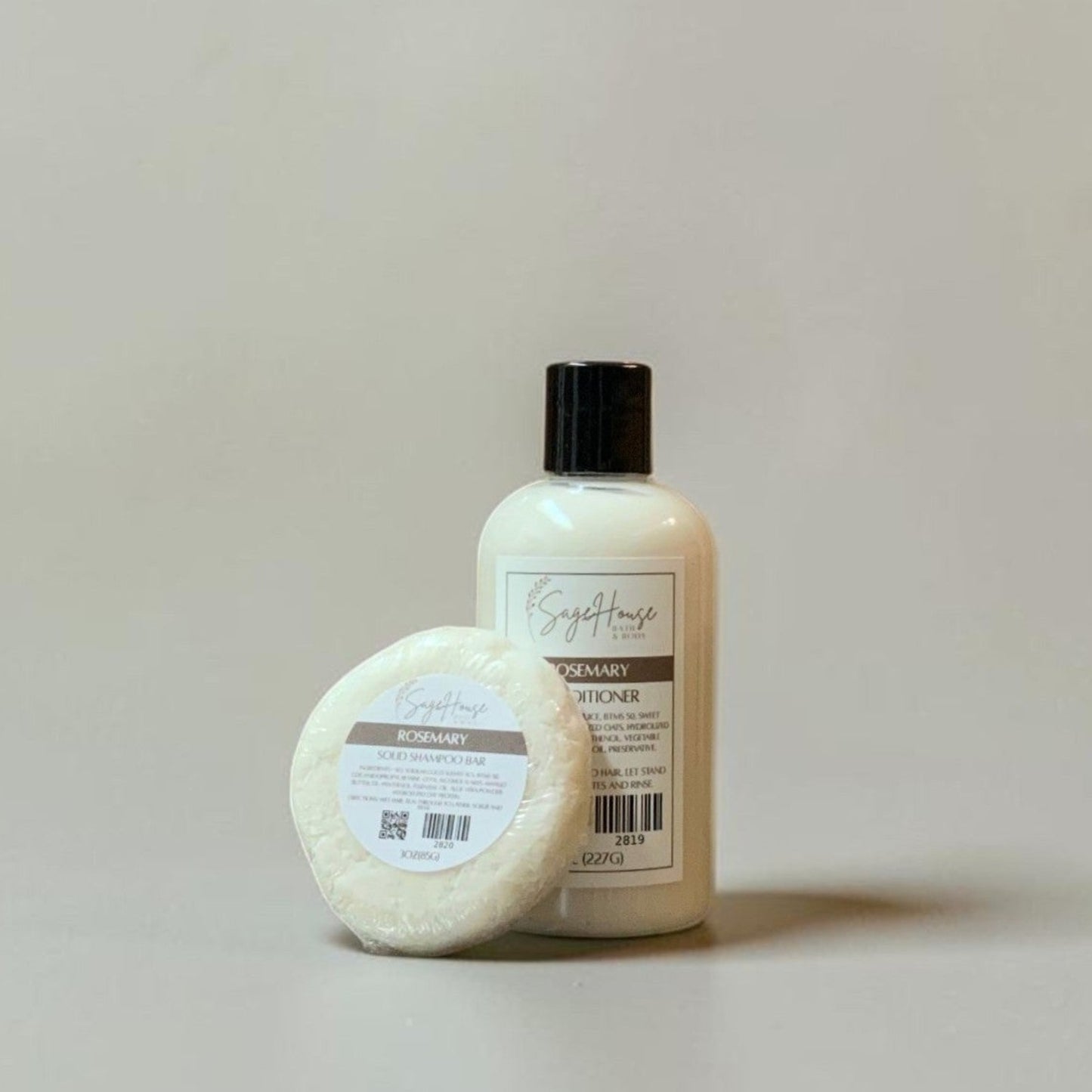 Bottle and shampoo bar on a plain background