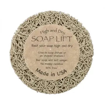 A round bone soap lift with product label in the middle. On white background.