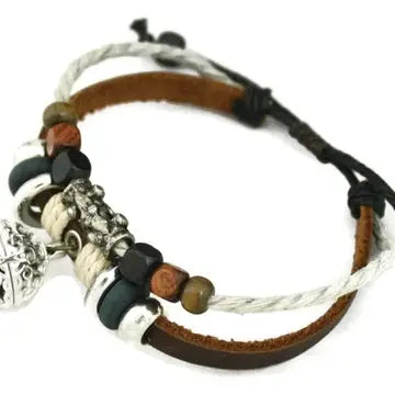 bracelet with brown leather and silver black & brown beaded accents. lava bead inside of silver ball