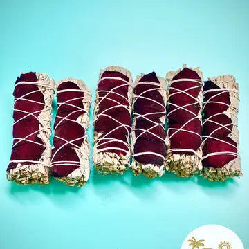 6 bundles of Sage & Rose with string. On turquoise colored background