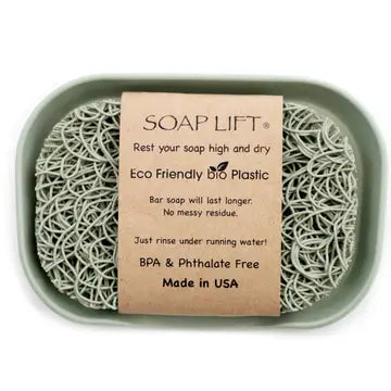 Sage colored soap dish with soap lift sitting inside. Soap lift sold seperately. On a white background