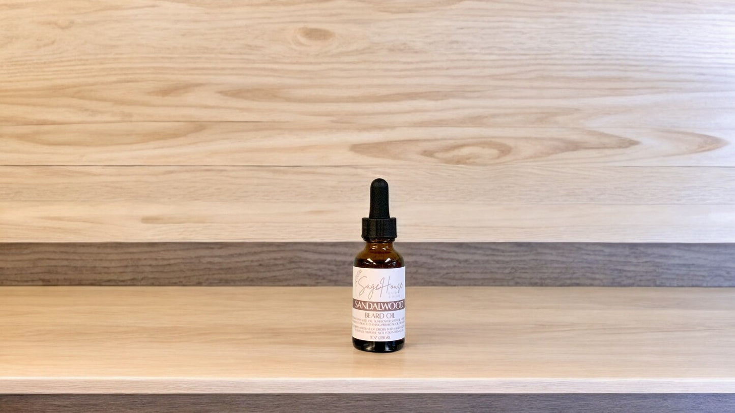 A dropper bottle labeled "sandalwood" on a wood top and background