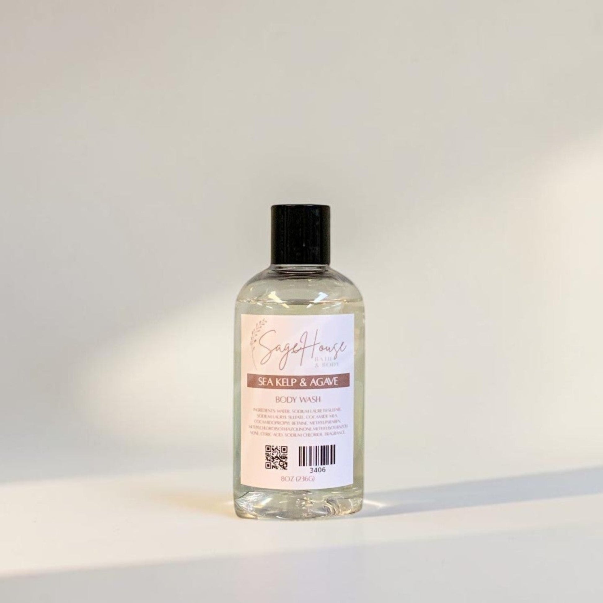 Clear bottle with black cap on a light gray background