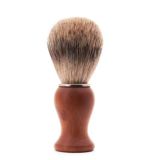 A shaving brush with medium color wood base and soft bristles
