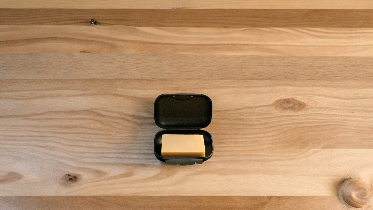 Soap Bar travel case with a soap displayed inside. On a wooden surface. Soap sold seperately