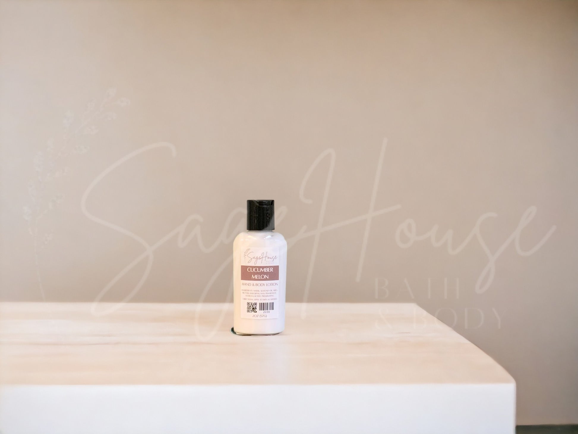 A small bottle of lotion with black cap on a wooden surface with a neutral background