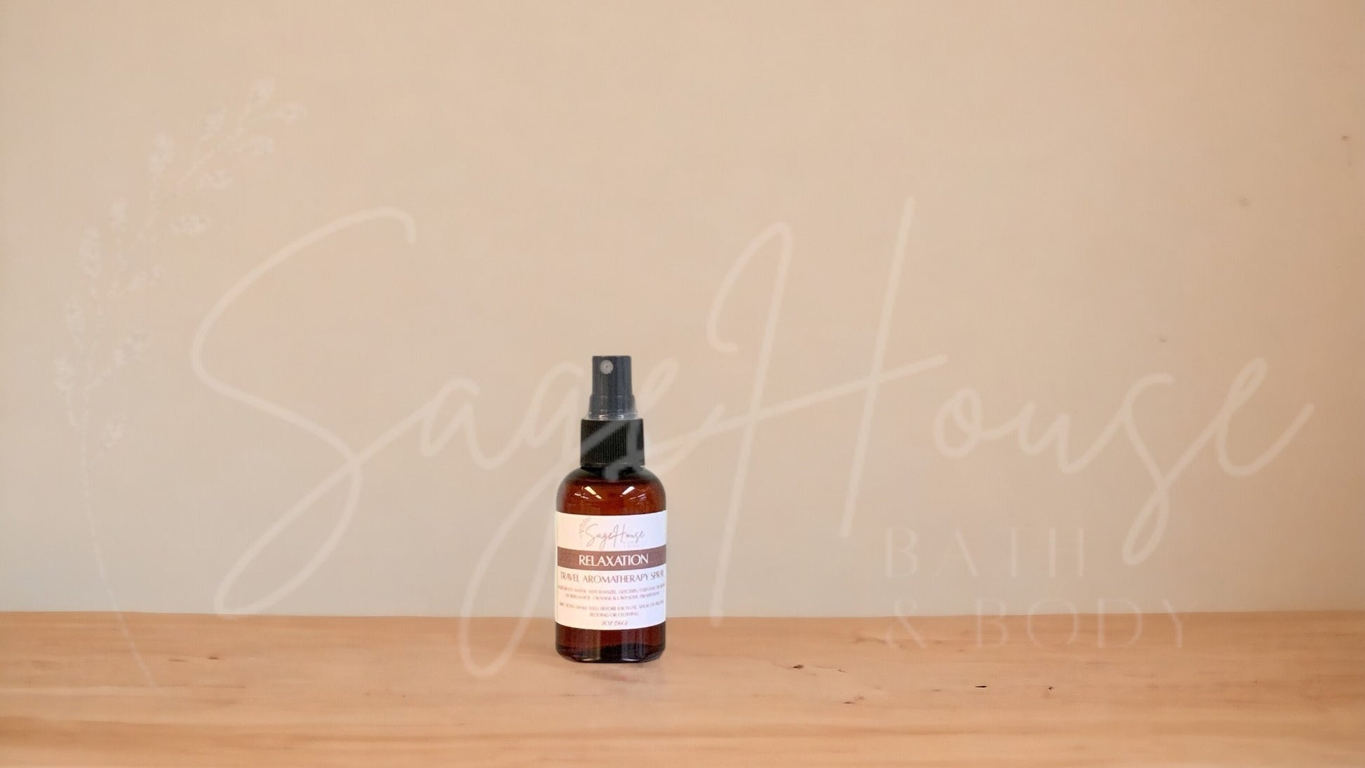Amber colored spritz bottle with relaxation label, on wood surface