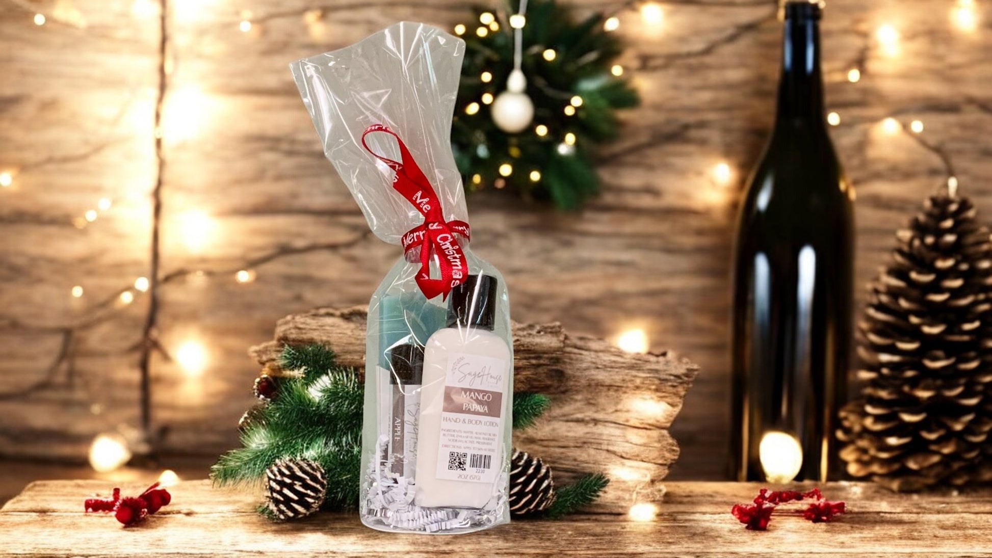 A small round giftset containing various bath and body products, tied with a red ribbon. On a wood surface with rustice theme in background