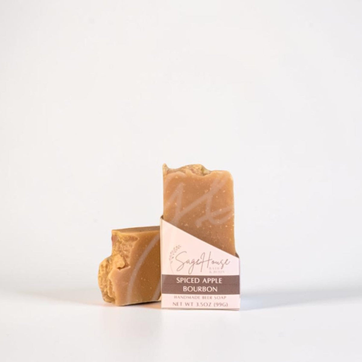 A labeled bar of soap sitting in front of a matching bar. On a white background.