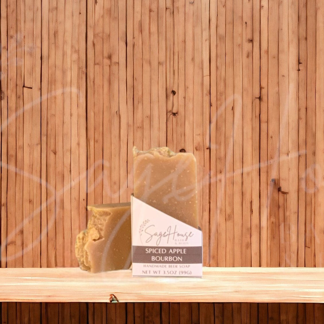 A tan colored bar of soap with a white label. on a wood surface.