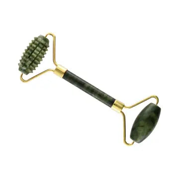 A jade stone roller with gold handles and a spiked roller on one end, with a smooth roller on the other.