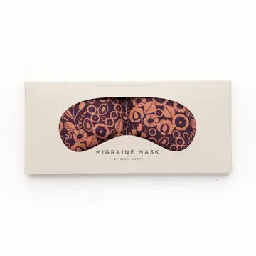 An eye mask therapy pack with a floral pattern in shades of burgundy and peach, displayed on a white background.