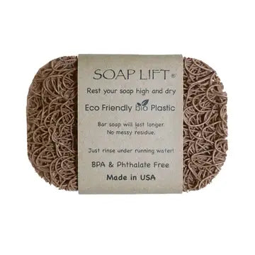 A tan soap lift with product band around the middle. On white background.