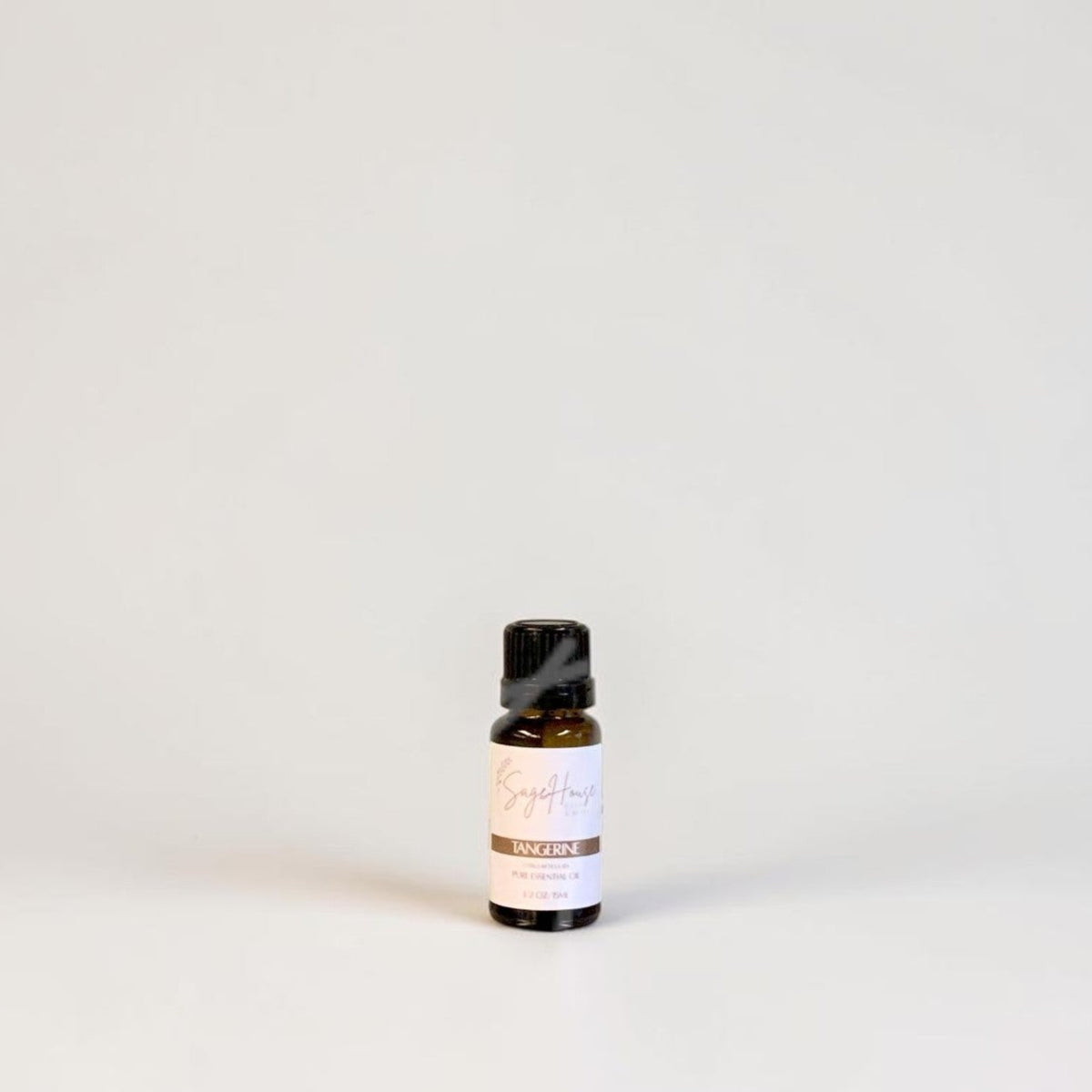 Amber bottle with label on a grey background.