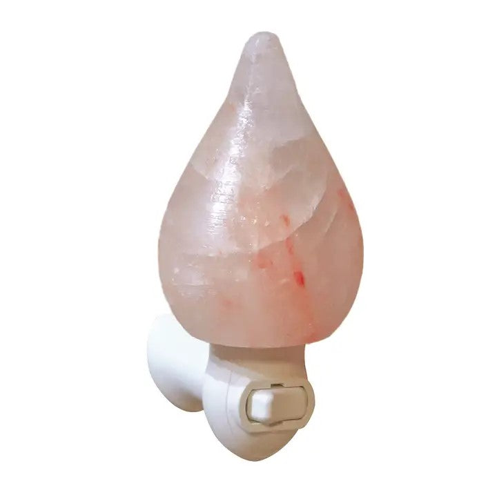 A pink Himalayan salt tear drop shape lamp on a night light plug in base